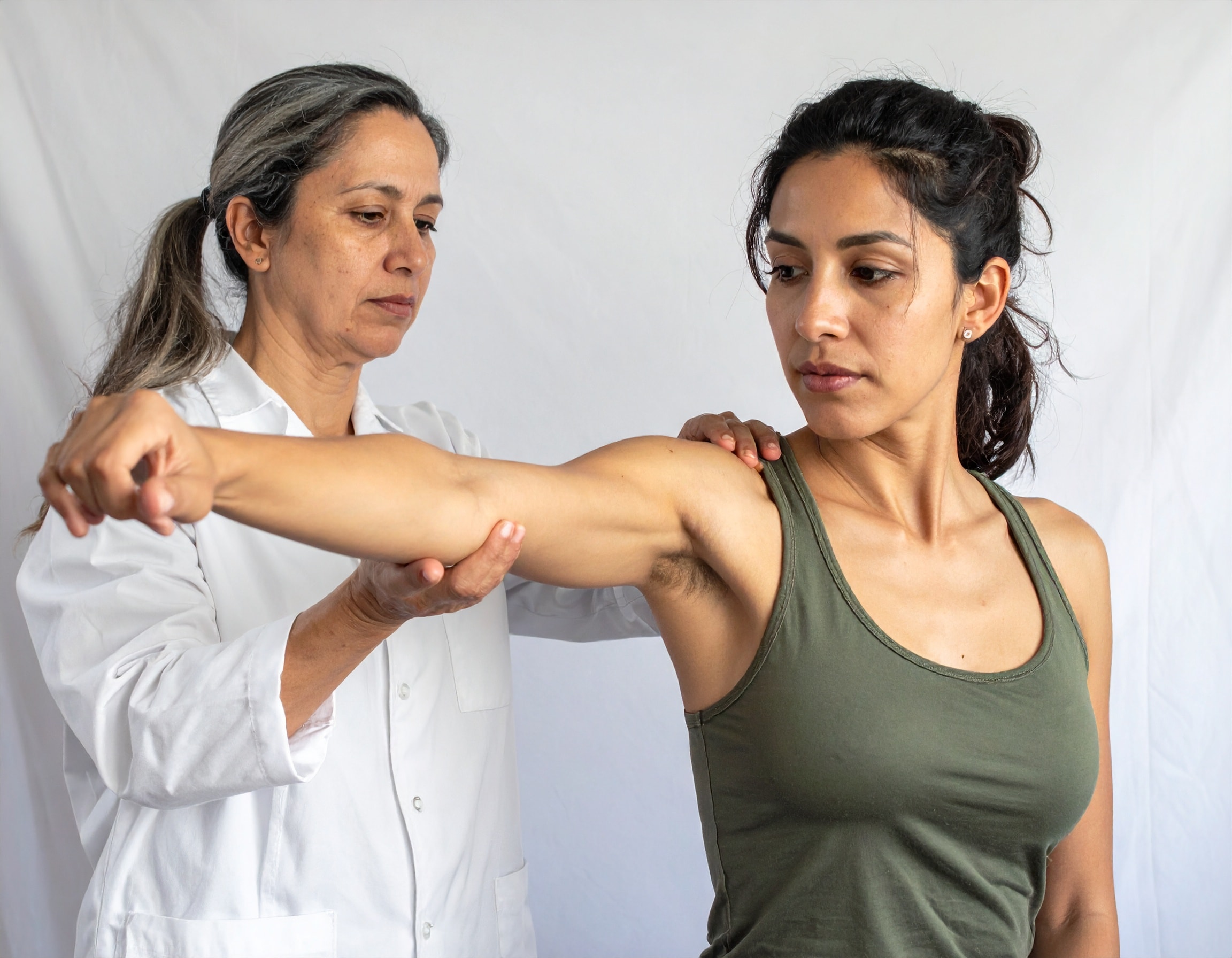 Doctor checking patients hand joint pain